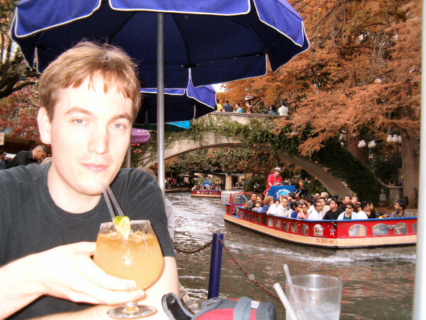 Guus at the riverwalk with a drink.
